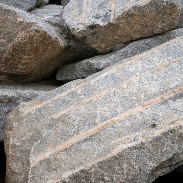 Blasted Granite landscape boulders in pile at rock yard