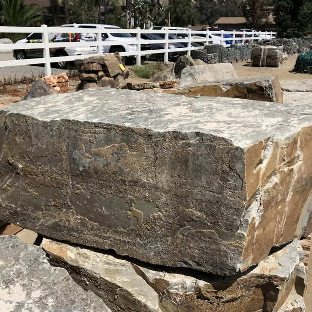 Steelhead Bench landscape boulder slabs on pallet in rock yard