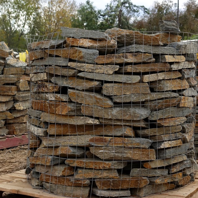 Red mountain natural ledgestone stacked on pallet at rock yard