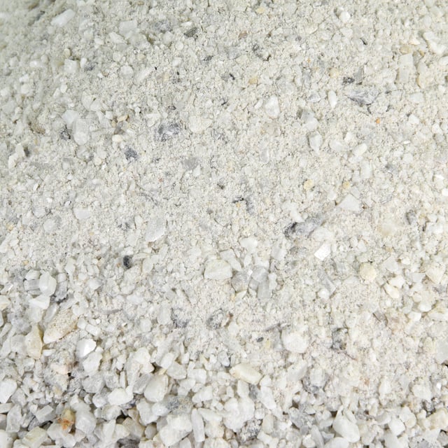 Smokey white ice decomposed granite fines in bulk at rock yard