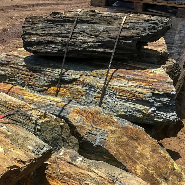 Rainbow Rock landscape boulders in bulk at rock yard