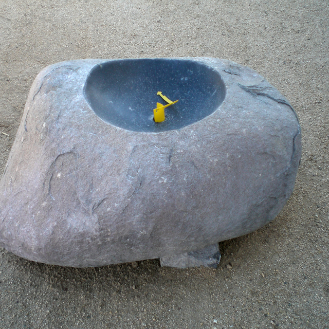 Rustic green bowl stone wabi fountain at rock yard