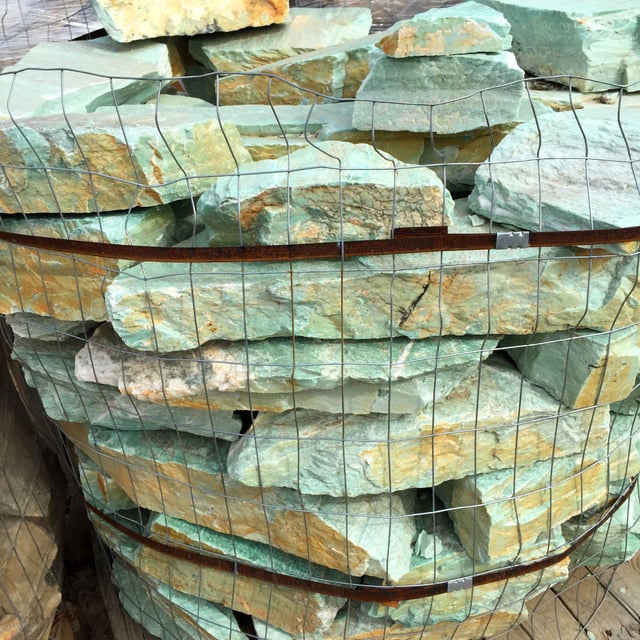 Oro Verde Dry Wall Rock in wire basket at rock yard