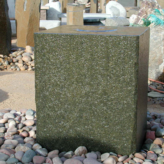 Granite cube stone fountain installed over arizona cobble pebble