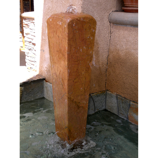 Vase custom stone fountain installed in pond in front yard