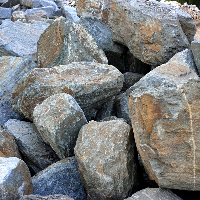 Red Mountain landscape boulders in pile in rock yard
