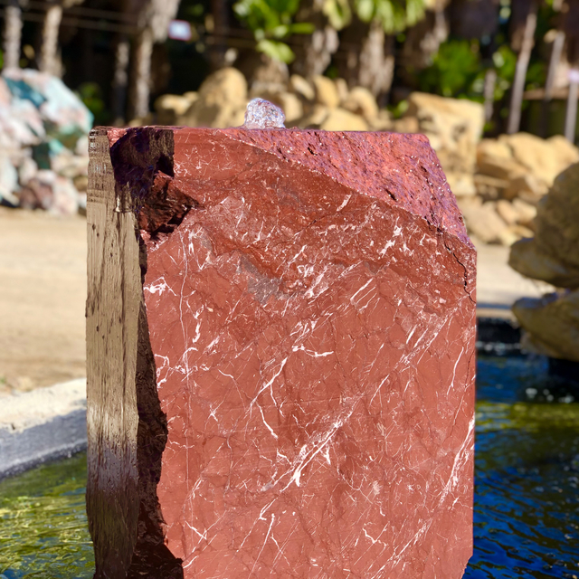 Wine Natural Boulder Fountain displayed in water feature showcase at rock yard
