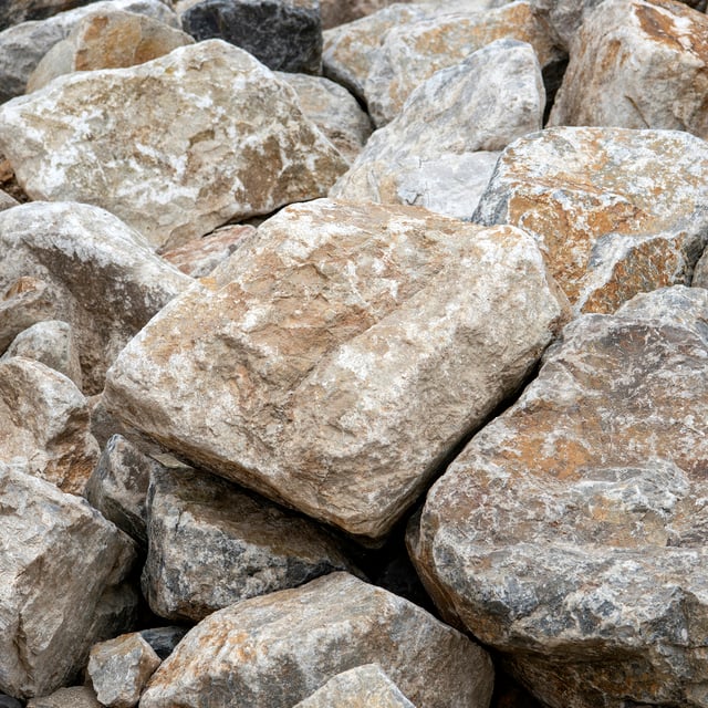 Smokey White landscape boulder pile in rock yard