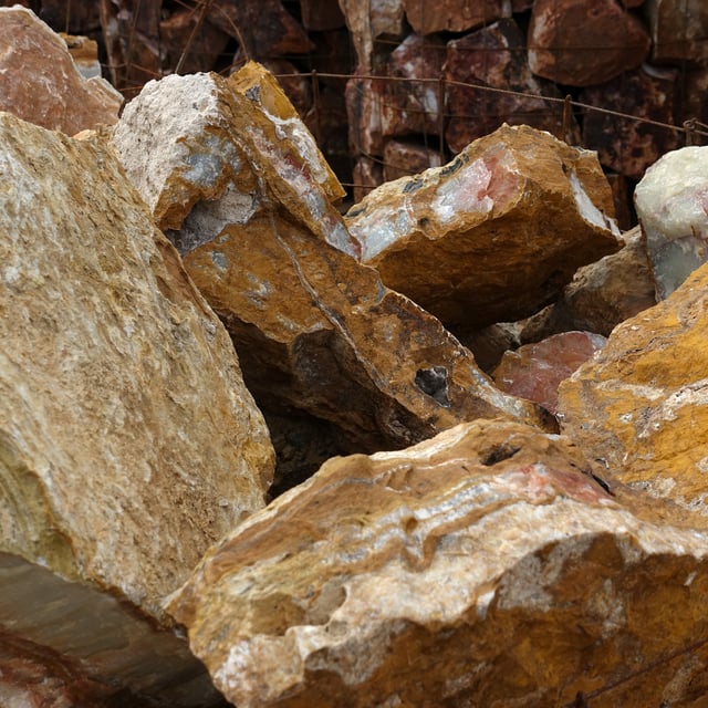 Mexican gold onyx boulder in bulk at rock yard