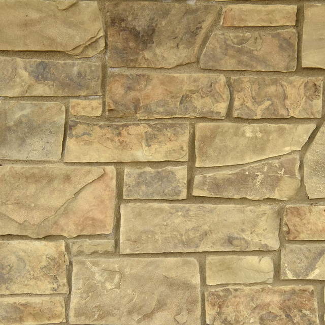Dappled Leather Stone Veneer Natural Ledgestone on rock wall project